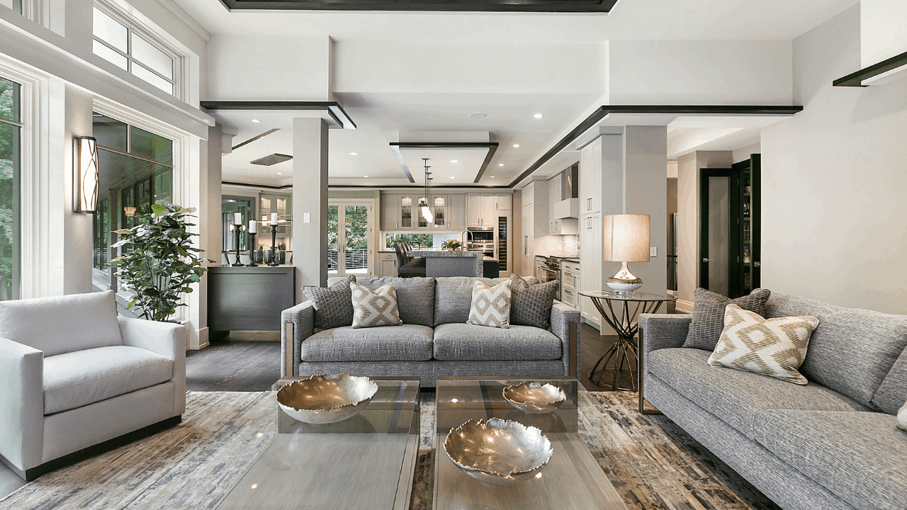 Contemporary San Diego home with a modern living room, tall windows, neutral decor, and a stylish open kitchen, featured on the home buying process page for Betty Torano Realtor.