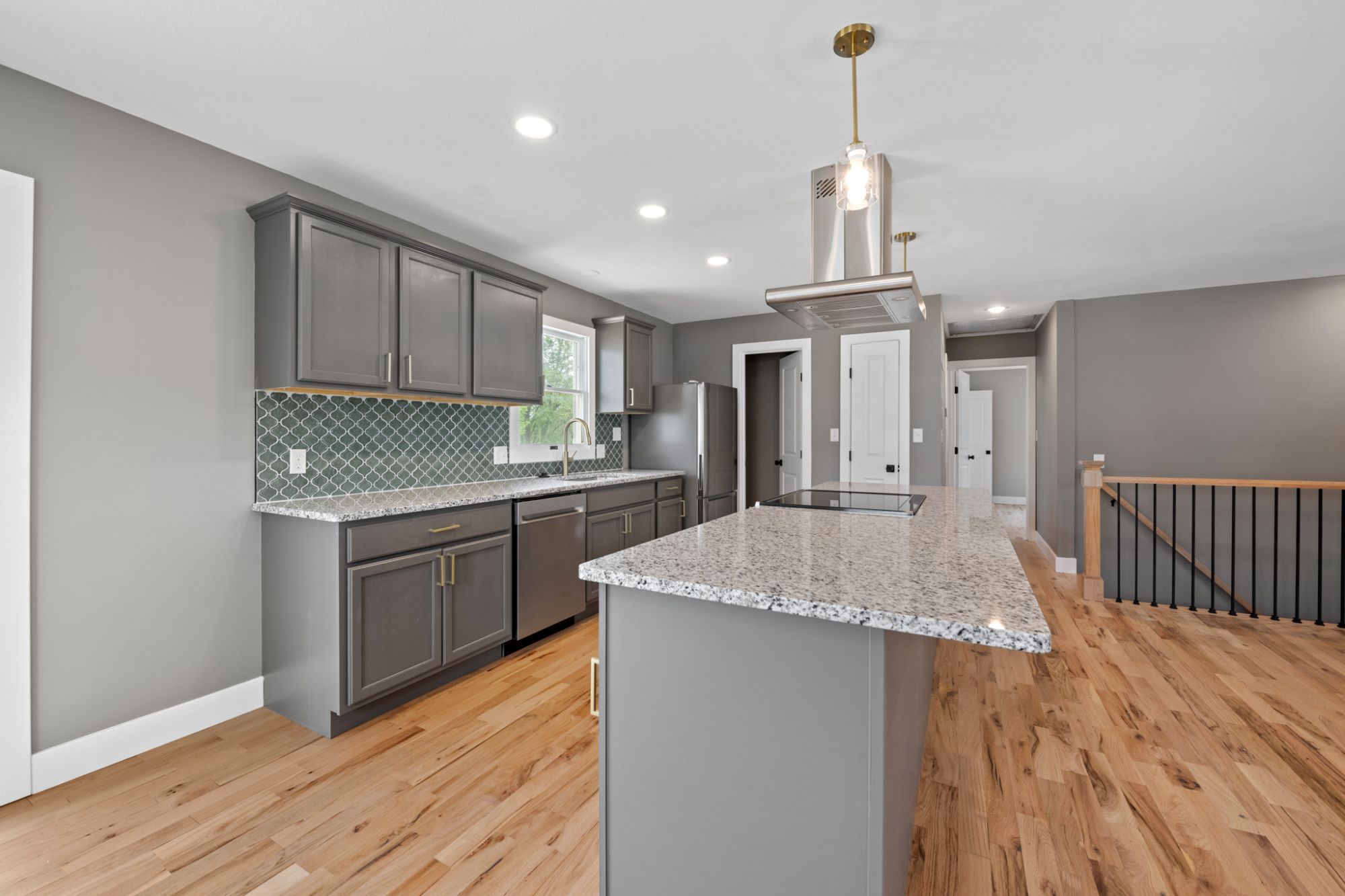 granite countertops, custom cabinetry, and brand-new appliances