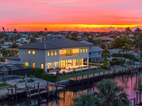 Marco Island luxury waterfront home with private 70' dock, direct Gulf access, and sunset views over the canal