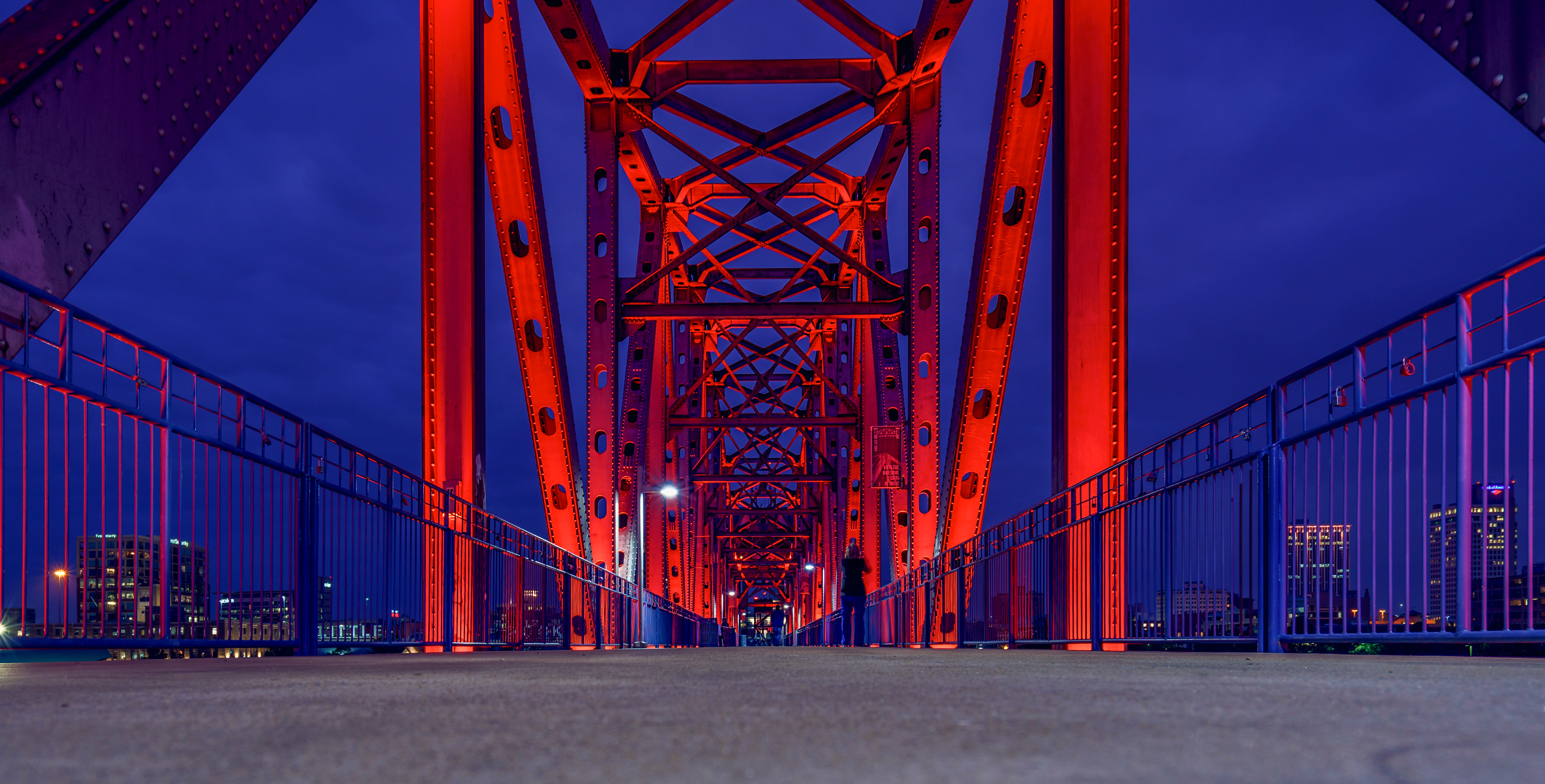 Illuminated bridge at night