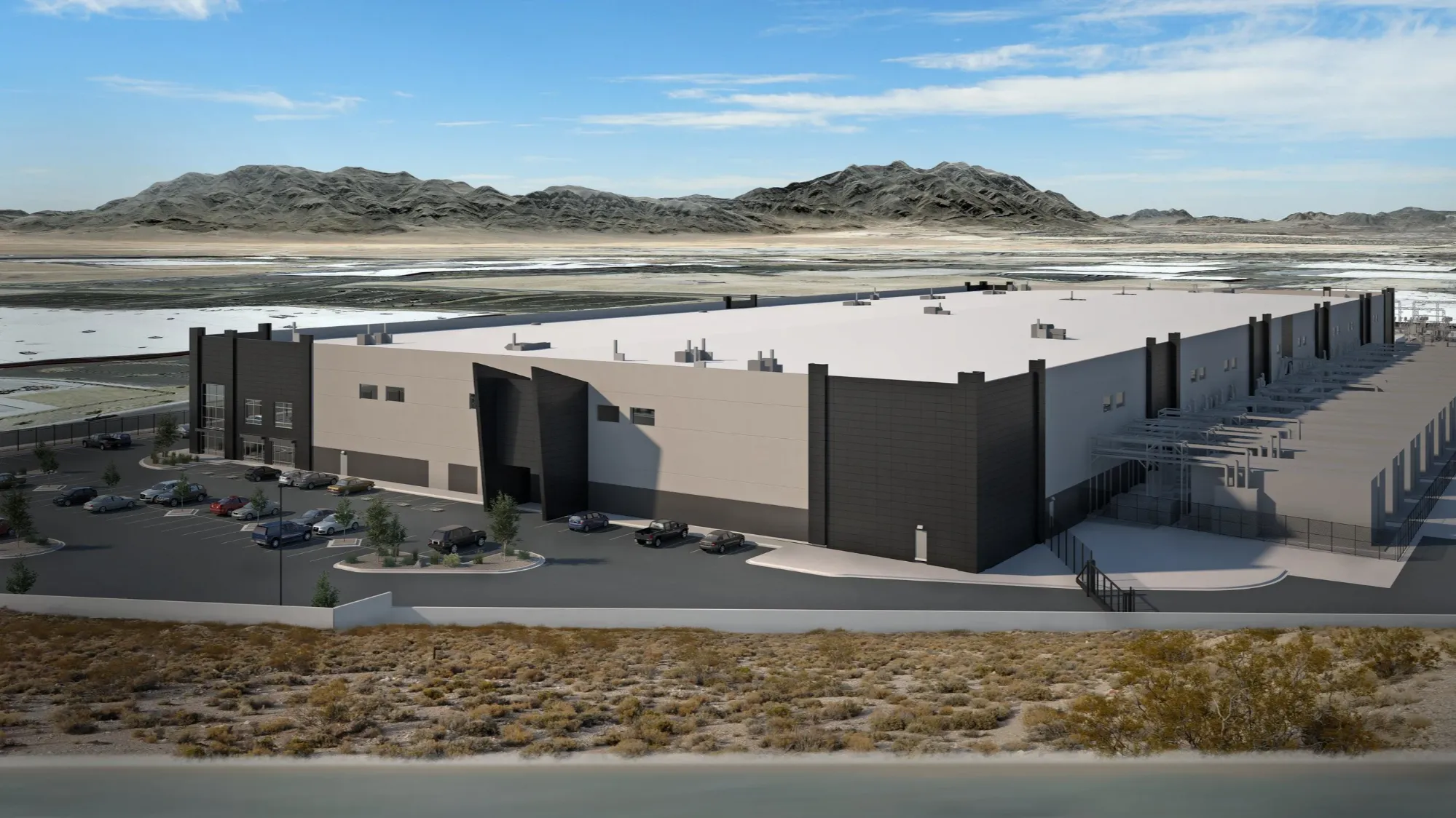 Rendering of a large industrial data center building in a desert setting with mountains in the background.