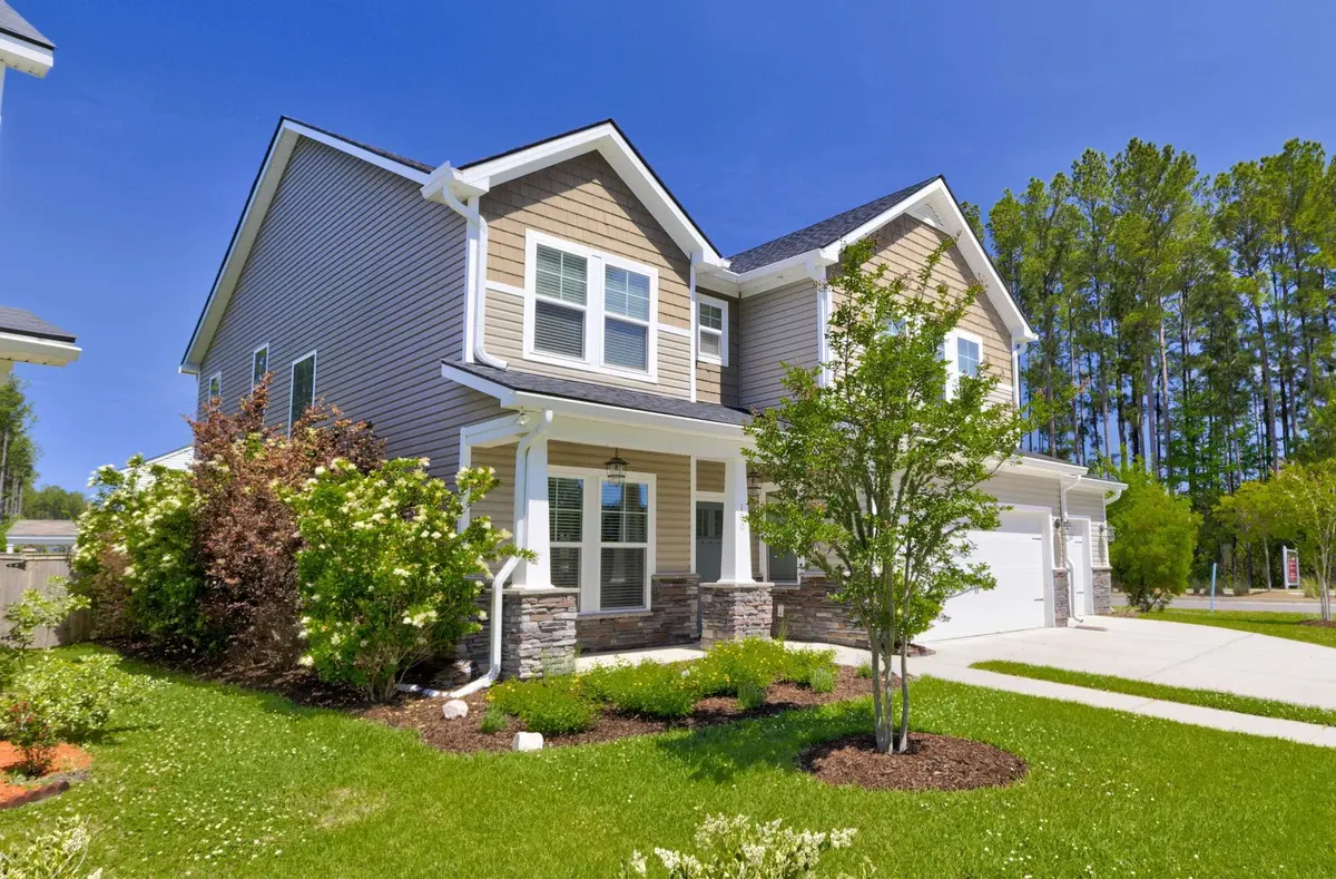 two story home with clean landscaping