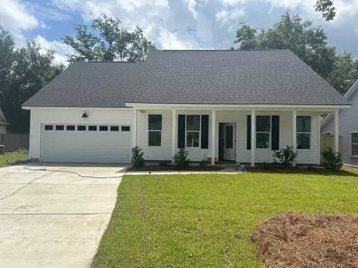 single-story white home with one-car garage