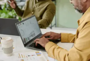 Investor analyzing MLS and off-market map data on a laptop