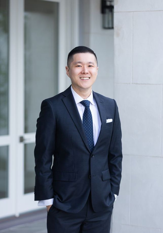 Josh Yoo with clients in the Bay Area real estate community