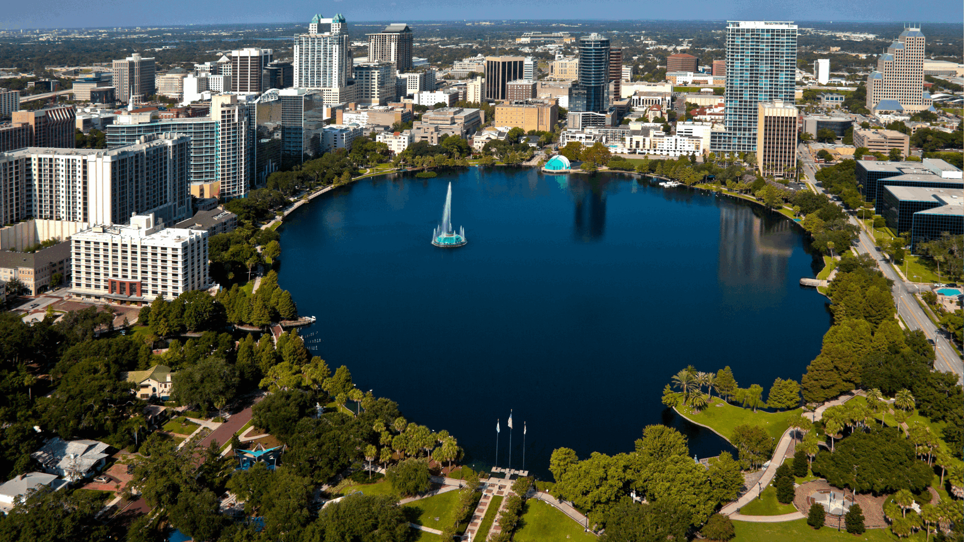 Alt: Downtown Orlando skyline with Lake Eola Park in 2026