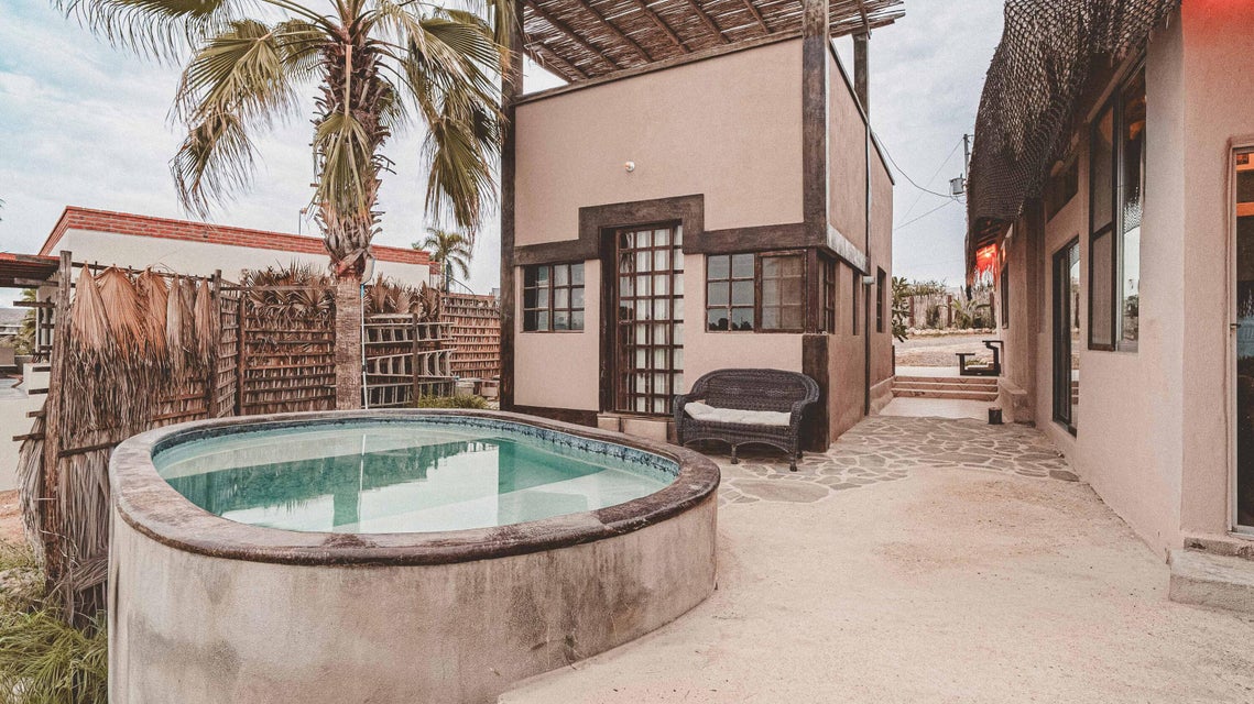 Rooftop deck and sunset views over the farmlands toward the ocean, El Pósito, Todos Santos