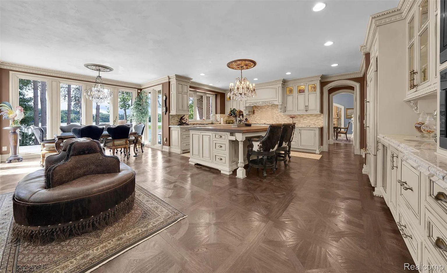 Gourmet chef kitchen with lighted quartzite island at 5621 Arbor Bay Court