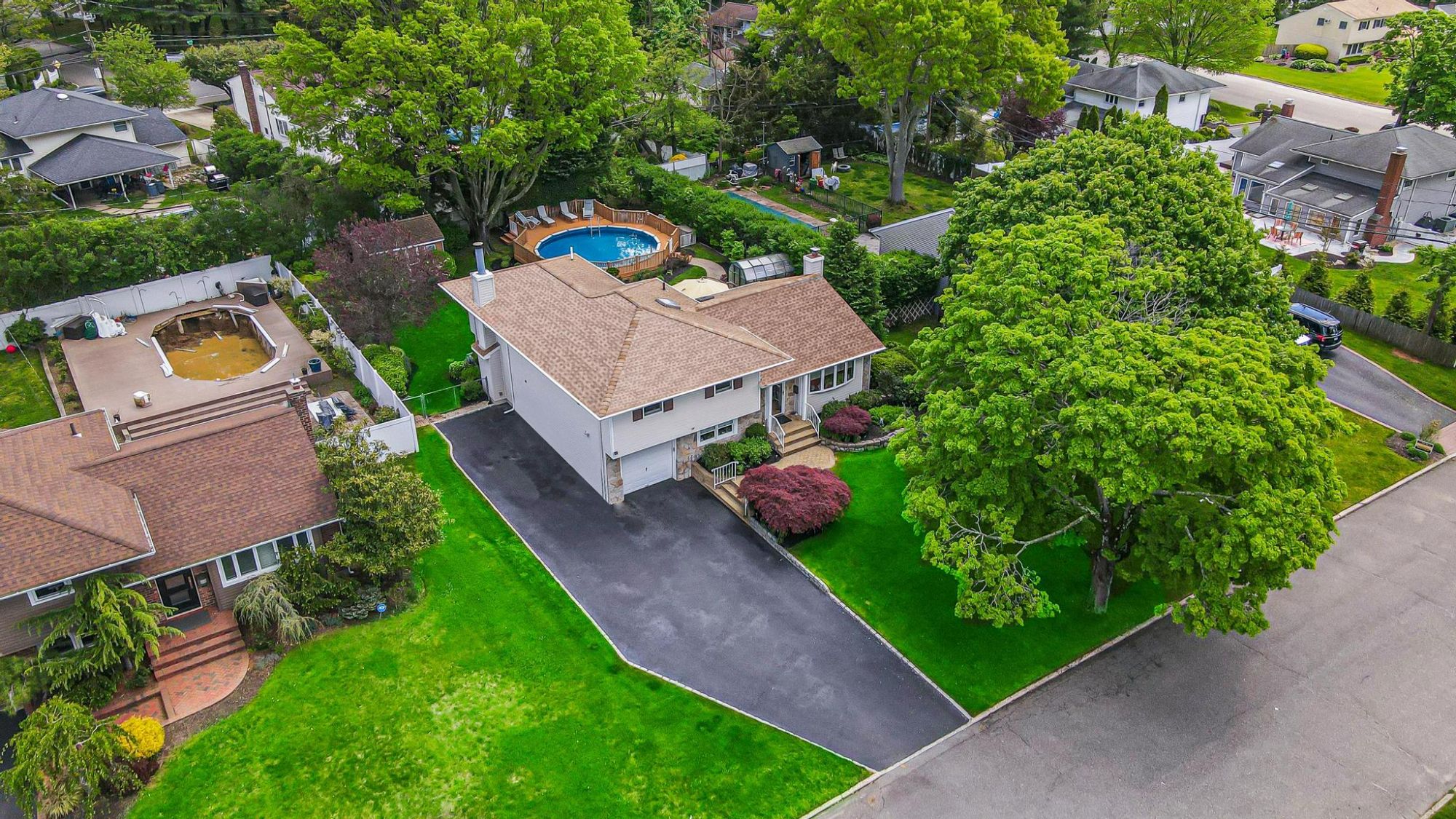 Aerial view of a Long Island home and surrounding properties