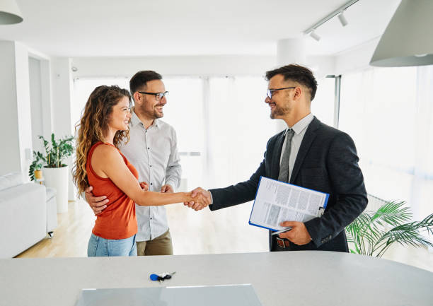 Stock Photo of real estate agent working with couple.