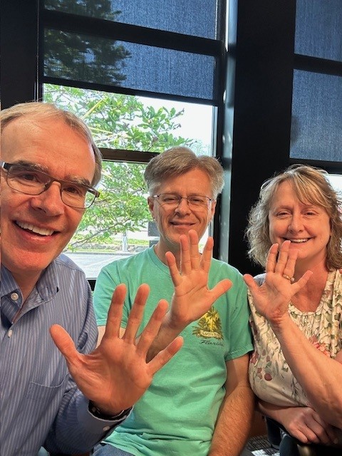 David and Sandy sitting with David Campbell, realtor after their 5th real estate transaction together in Centerville, Ohio.