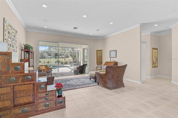 Living room view of golf course inside 2187 Muskogee Trail Nokomis Florida