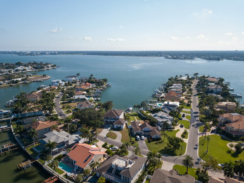 Waterfront houses with barrel tile roofs on the water in northeast Boca Raton