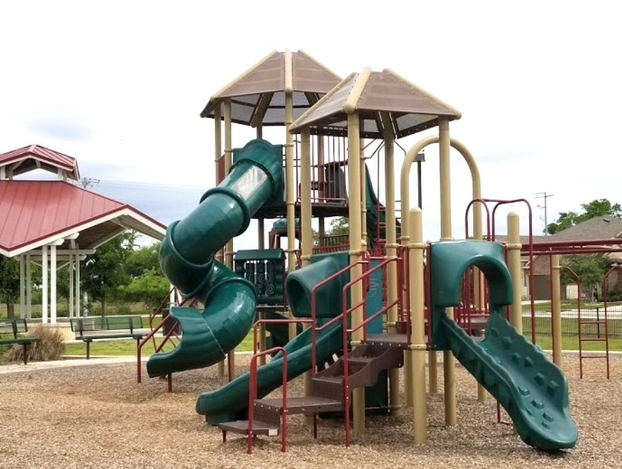 Schlather Park walking trails and playground adjacent to Buffalo Crossing homes.