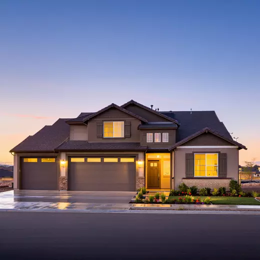 A single-family home stands in a suburban Texas neighborhood during golden hour