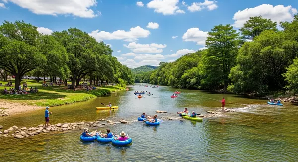 Outdoor activities on the Guadalupe River, with Landa Park's natural beauty and people enjoying tubing and kayaking