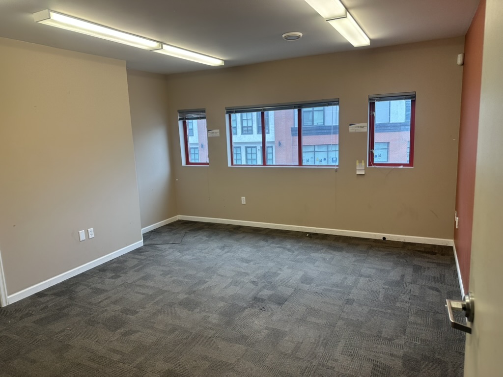 Downtown Nelson office space in the Gateway Building with large windows, neutral finishes, and a clean, professional layout ideal for small businesses.