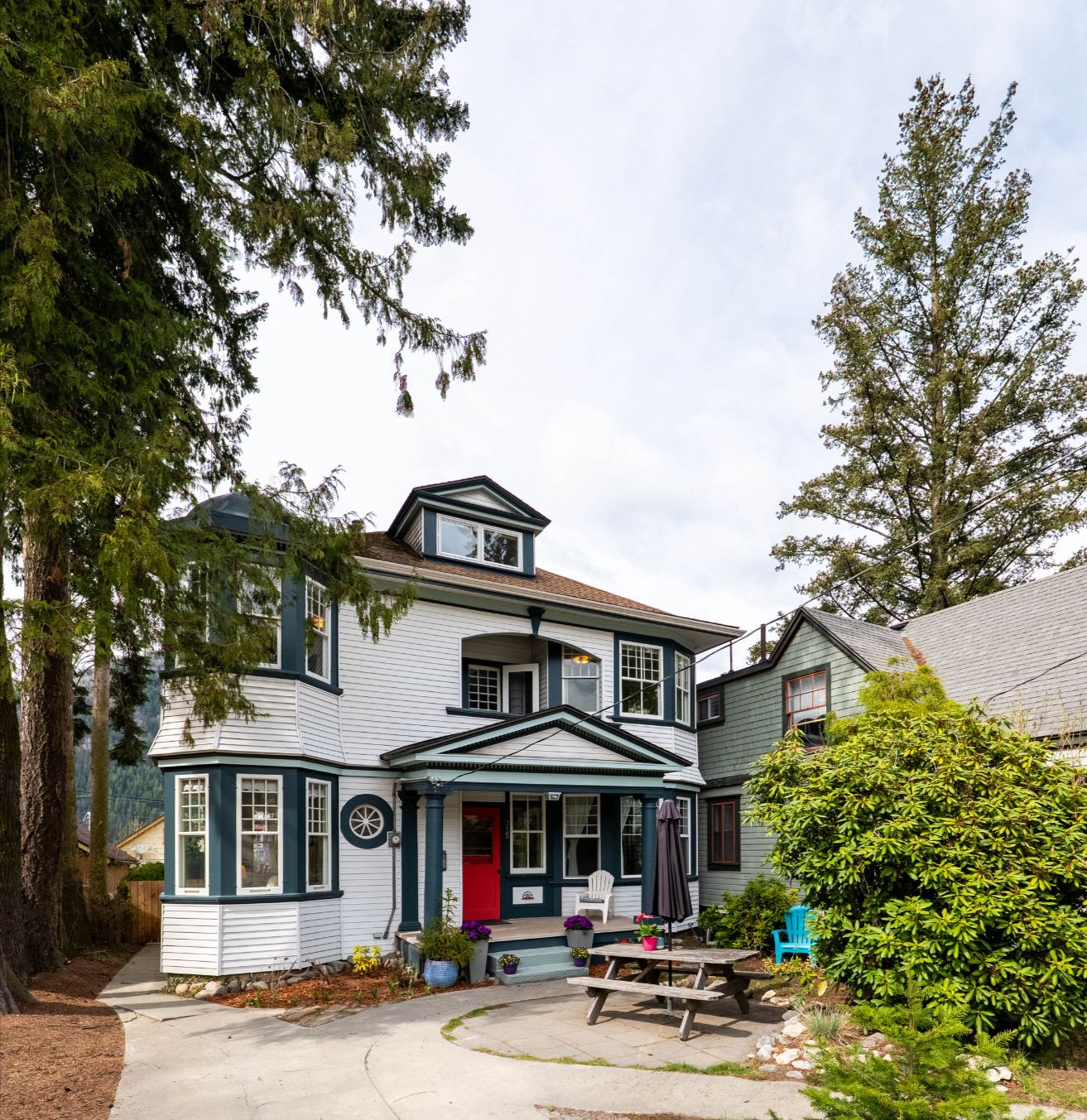 315 Silica Street captures everything there is to love about living in Nelson — historic charm, walkable convenience, and modern comfort. From the moment you arrive, the Queen Anne architecture and welcoming front porch draw you in. Inside, you’ll find beautifully renovated bathrooms, spacious bedrooms, and a flexible attic retreat perfect for a home office or guest suite. Step outside to a private backyard and deck ideal for entertaining or quiet mornings with coffee. With parking for two, room to grow in the basement, and just steps to downtown shops, cafes, and parks, this home blends timeless elegance with everyday practicality — a rare gem in the heart of the Kootenays.
