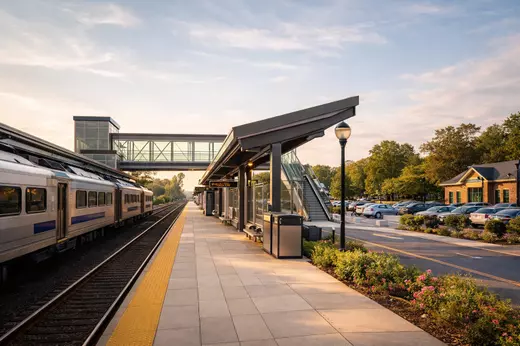 Modern North Jersey train station with calm platform and parking area, highlighting commuter friendly living for NYC and out of state buyers