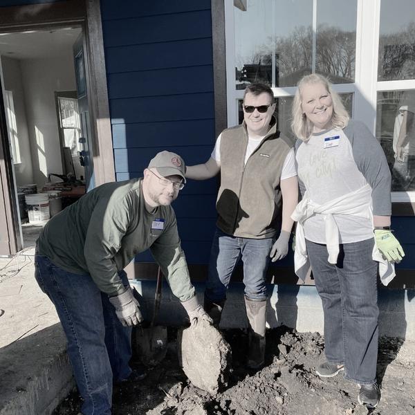 Deb Long working with Birmingham Association of Realtors members on a Habitat for Humanity home build.