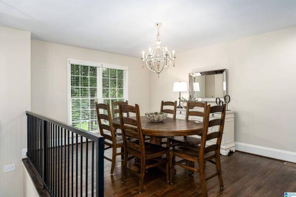 KEYSTONE DR, another view of the dining room, double windows with blinds, spacious room fits table of 8, oak wood floors