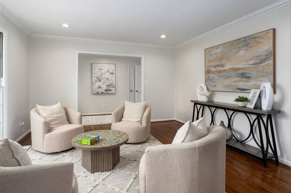 A versatile front living area, ideal for a game room, reading lounge, or additional gathering space, with easy flow back to the entry.