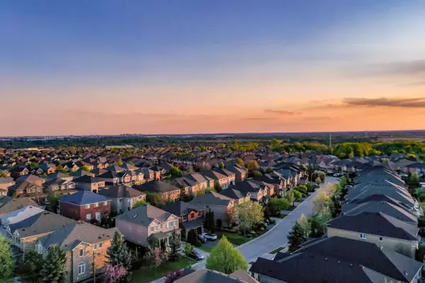 Aerial drone view of a Central California neighborhood at sunset – Living Central CA real estate, The Lopez Group at Real Brokerage