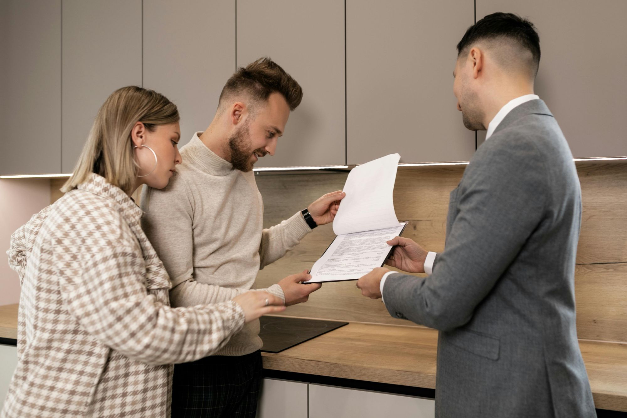 Couple reviewing a home purchase contract