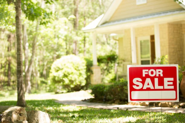 For sale sign outside a home in a nice neighborhood