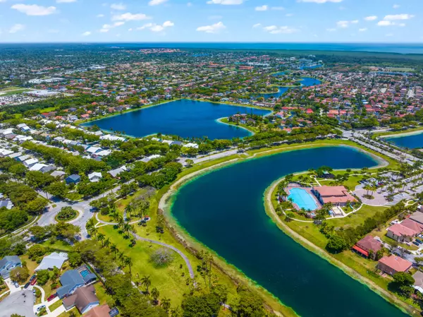 Aerial view of water ways and homes in Southern FL with ocean in distance