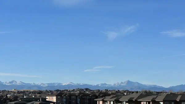Denver metro skyline with the Rocky Mountains in the background