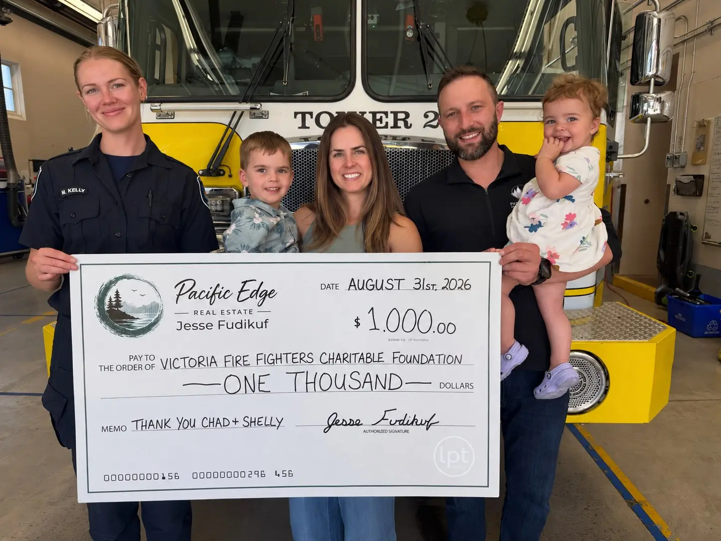 A $1,000 donation to the Victoria Fire Fighters Charitable Foundation, presented at the fire hall
