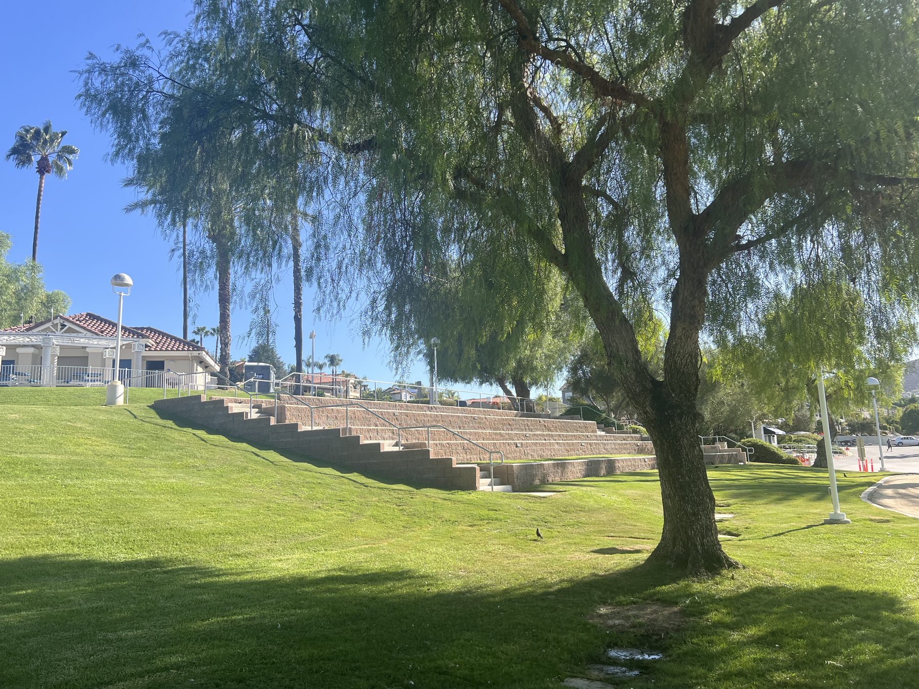 The grass amphitheater seating that faces the Holiday Harbor stage at Canyon Lake.