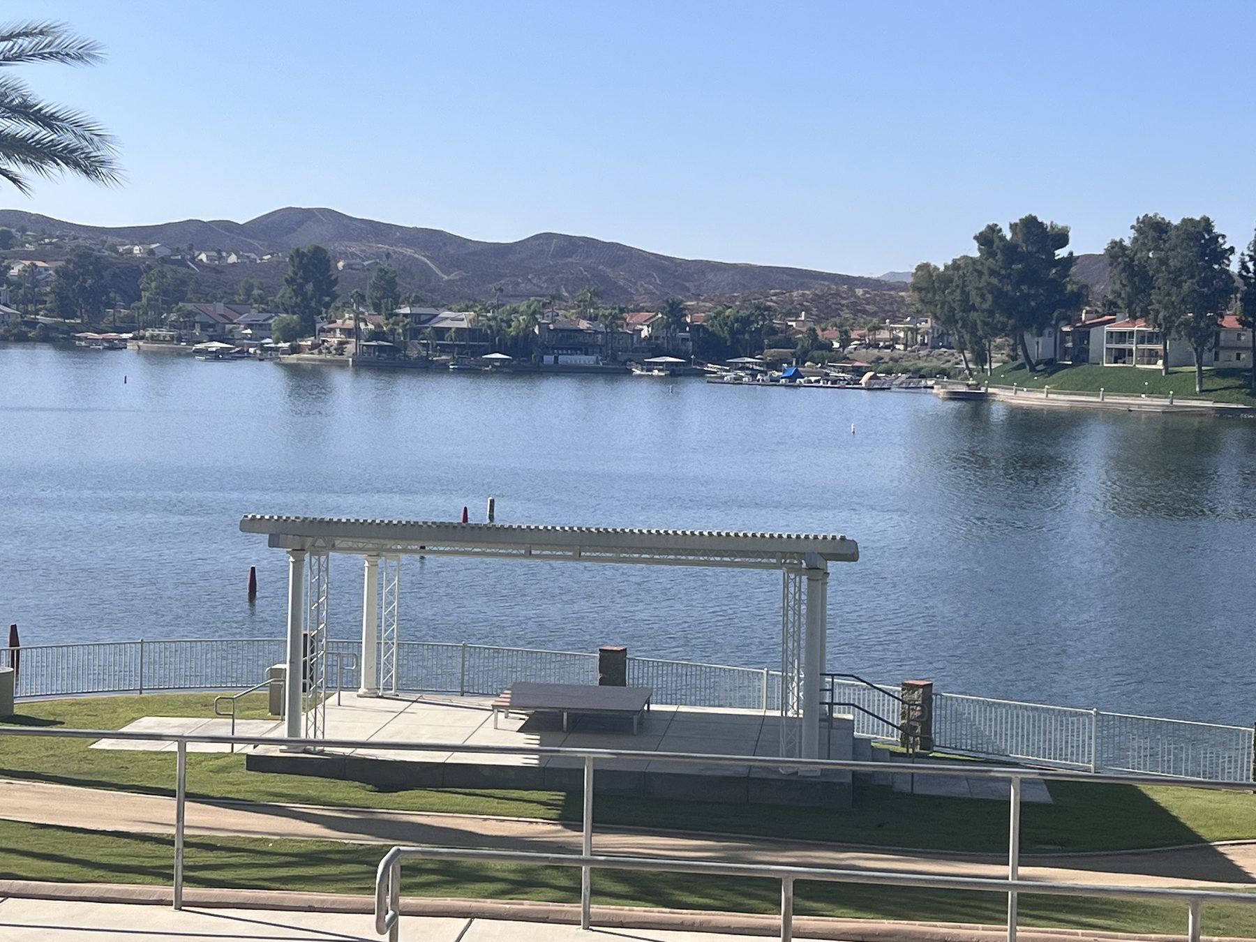 The outdoor concert stage at Holiday Harbor in Canyon Lake, with the lake directly behind it.
