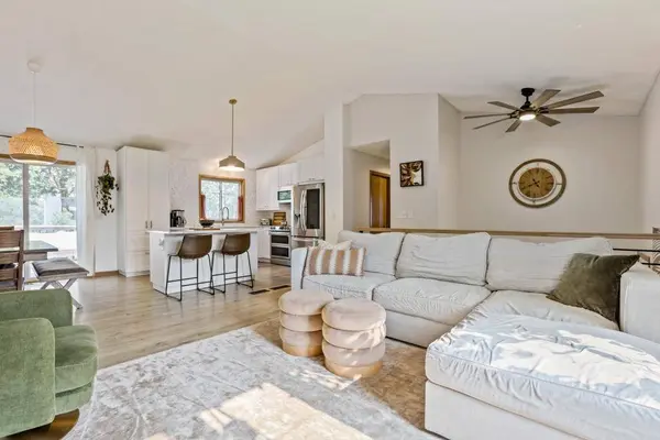 Open Concept Livingroom connected directly to dining room and Kitchen with eat at island in Lakeville MN