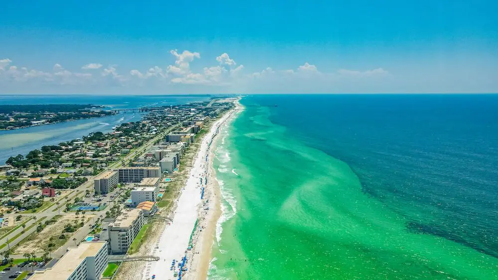 Aerial view of Miramar Beach, Florida, featuring white-sand beaches, turquoise Gulf waters, and coastal development.