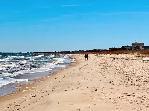 Couple walking on Virginia Beach
