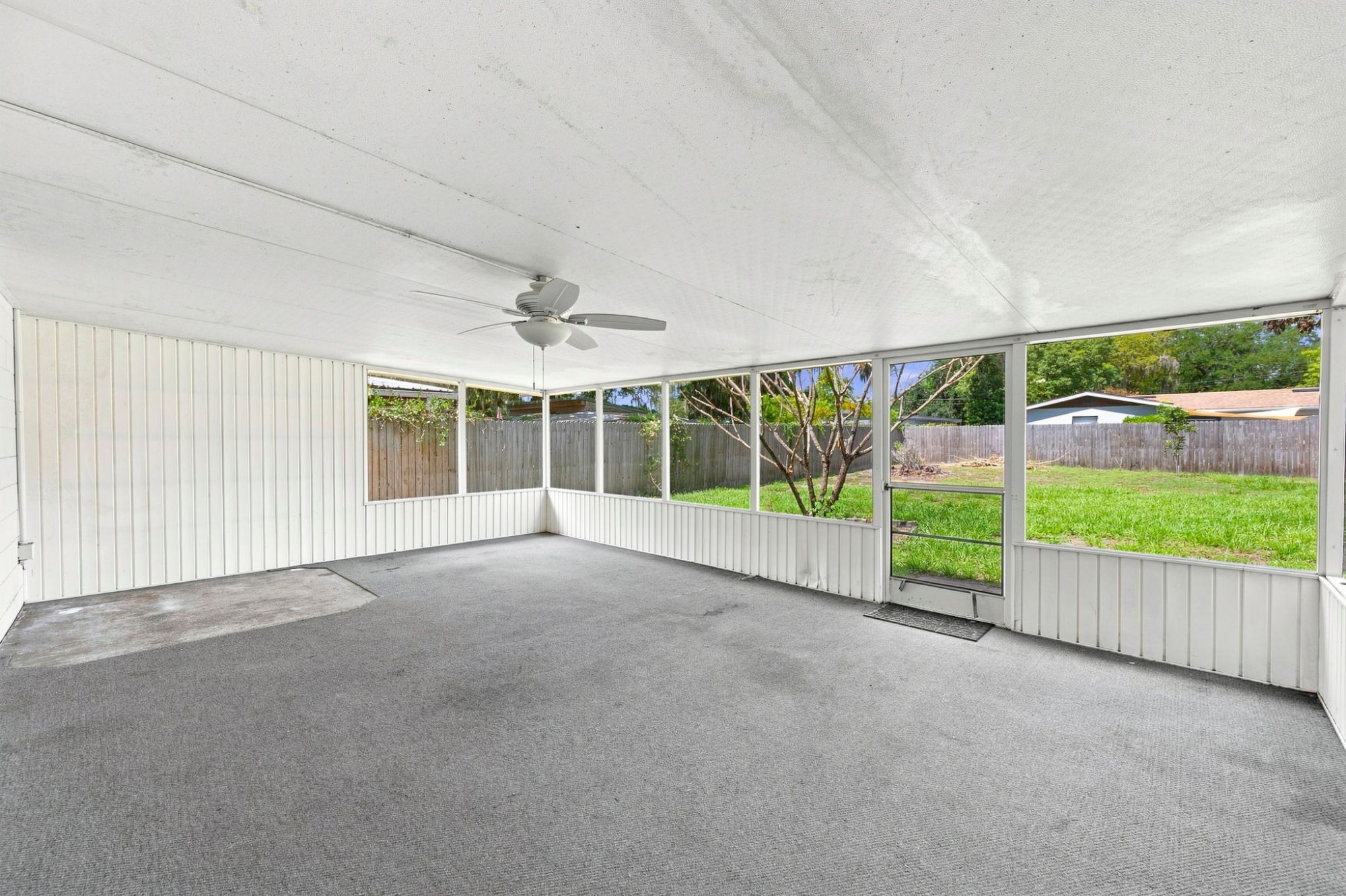 Large screened Florida Room overlooking the fenced backyard