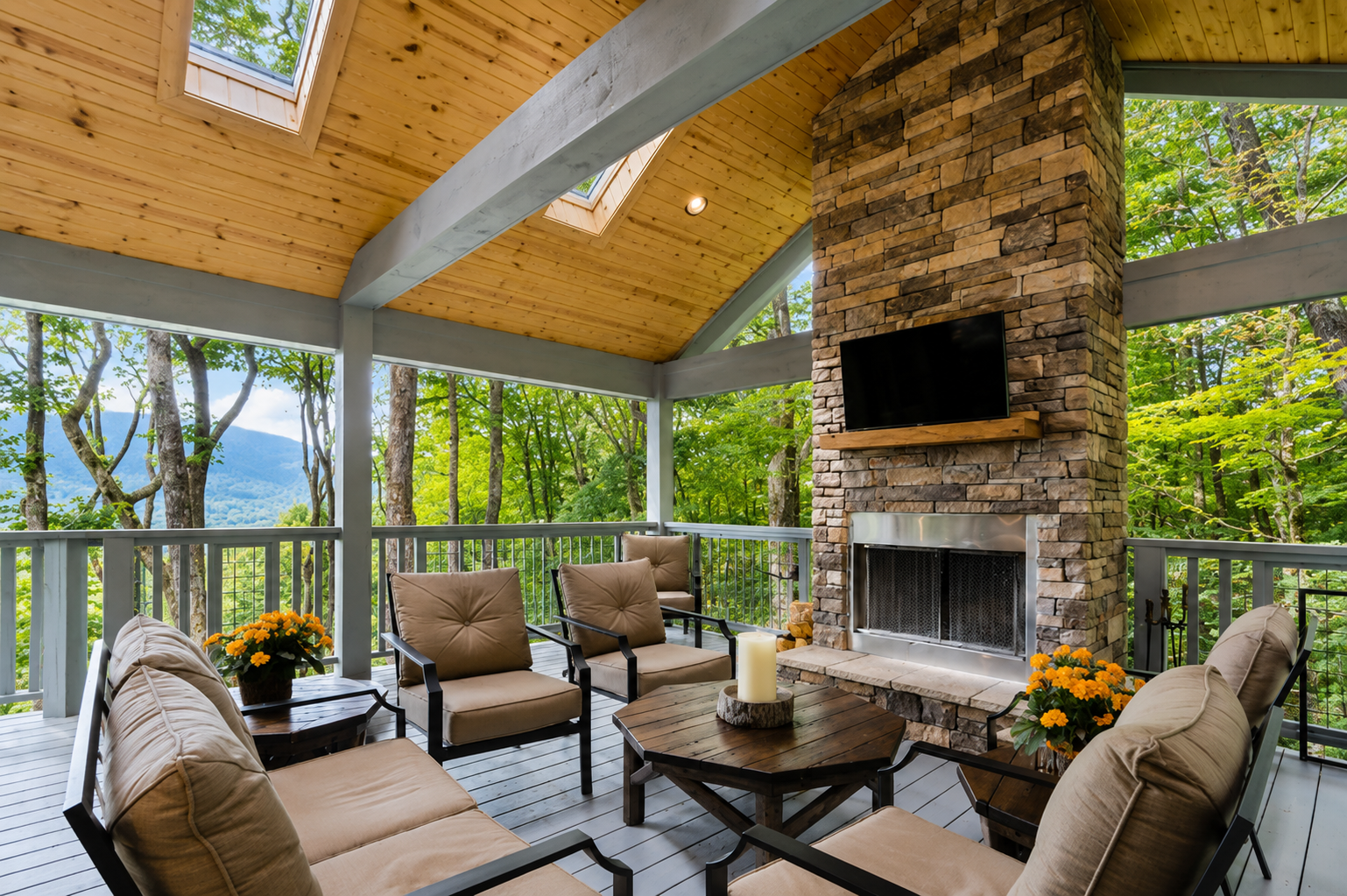 Cabin porch with fireplace and mountain background