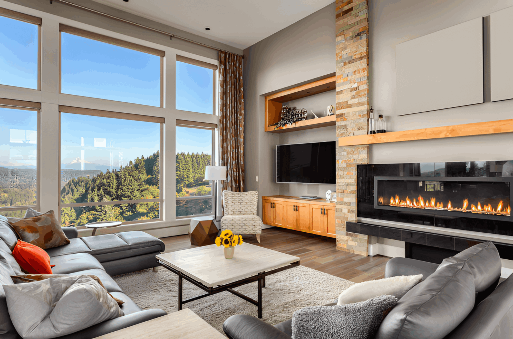 Living room with fireplace and mountain view
