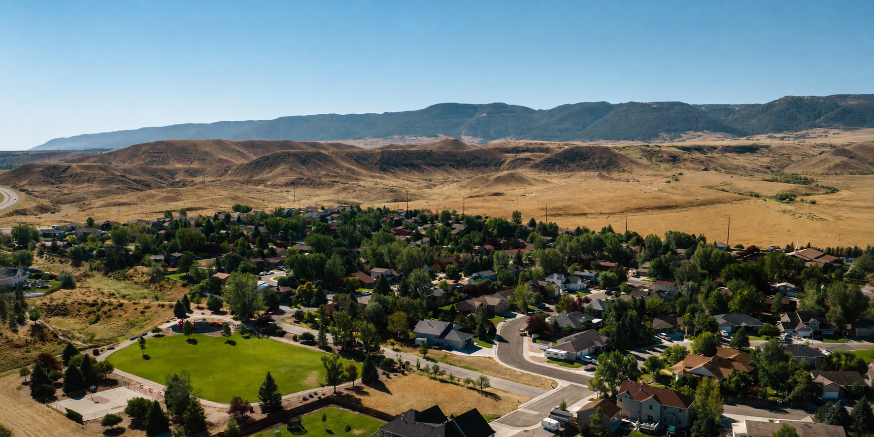 Aerial view of a Casper, Wyoming neighborhood with Casper Mountain in the distance