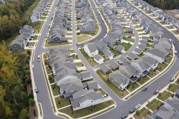 Aerial view of a modern residential area with winding roads