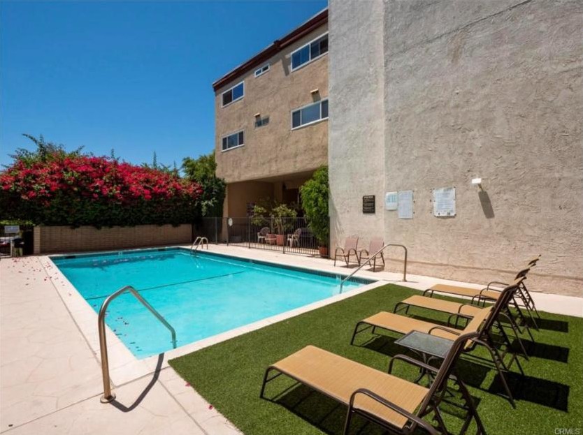 Pool and lounge chairs in the courtyard at 5412 Lindley Avenue, Encino