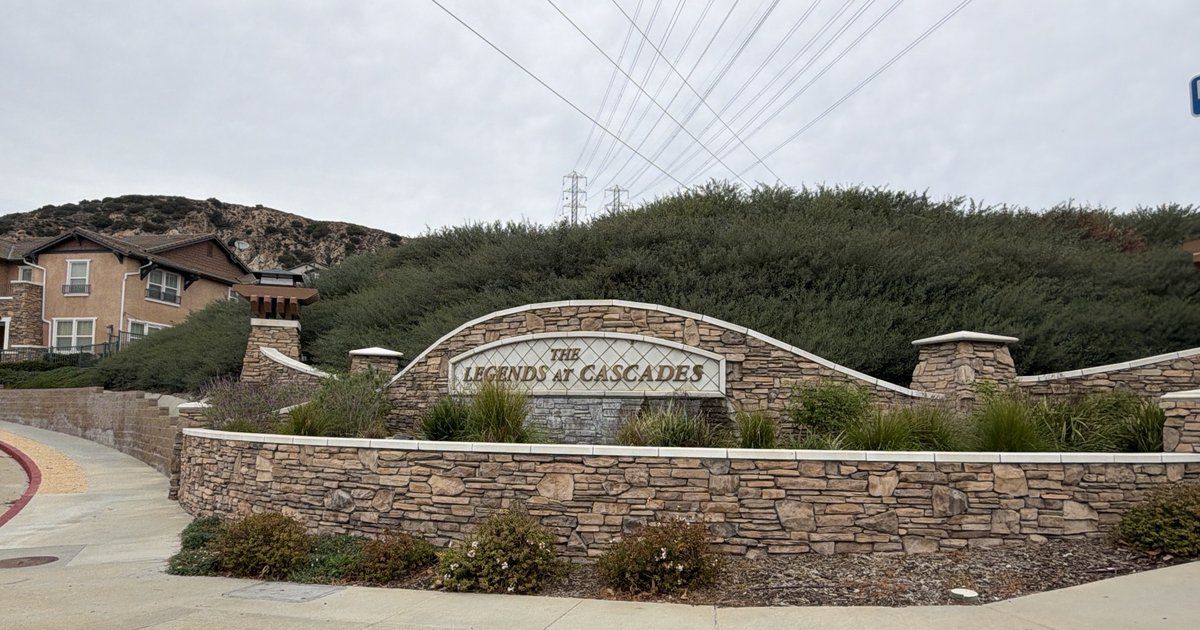 Stone entrance monument of The Legends at Cascades townhome community in Rancho Cascades, Sylmar