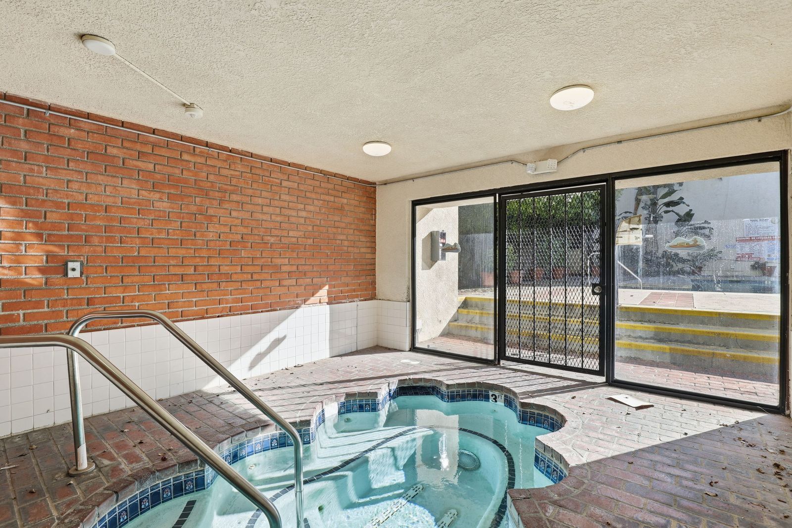 Enclosed spa room off the pool deck at The Lindbrook condos in Encino