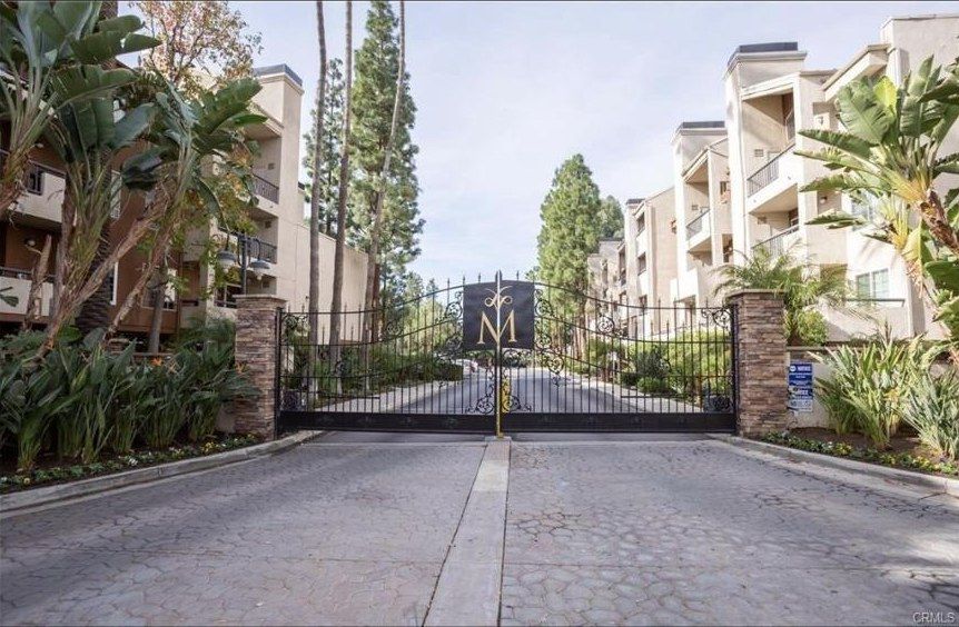 Gated vehicle entrance at The Met Warner Center condominiums
