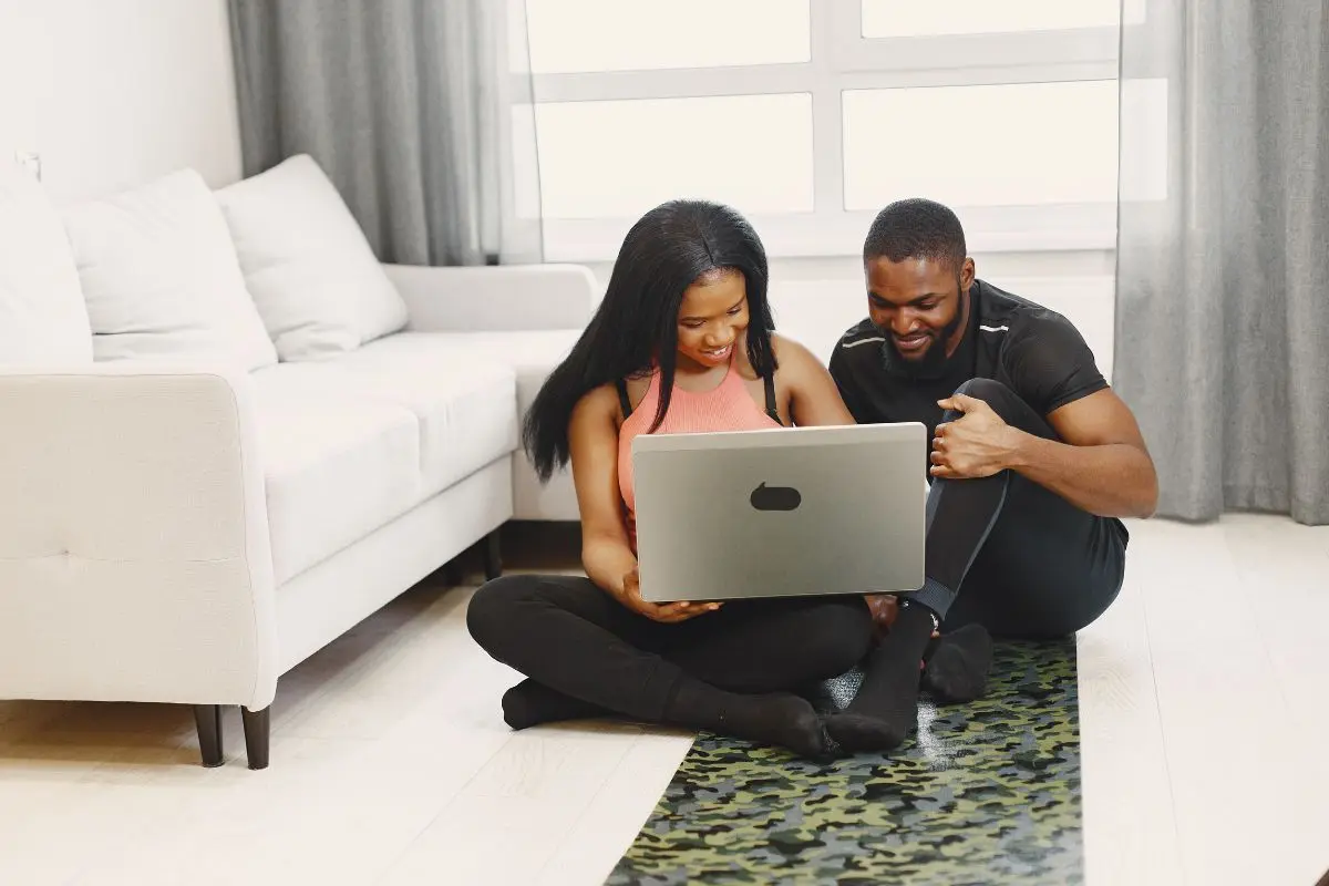 Home buyers completing an online mortgage application.