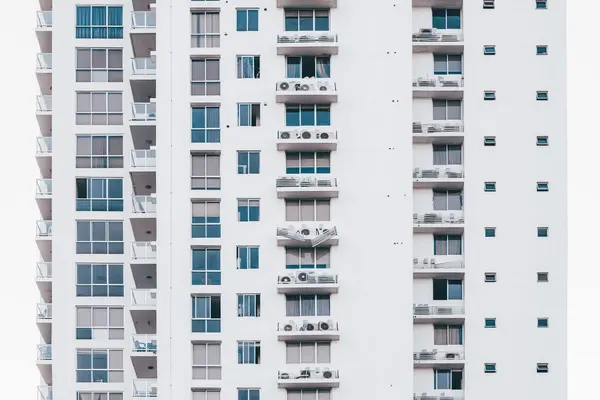 Modern condominium building with glass balconies