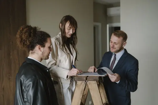 Couple reviewing home purchase documents