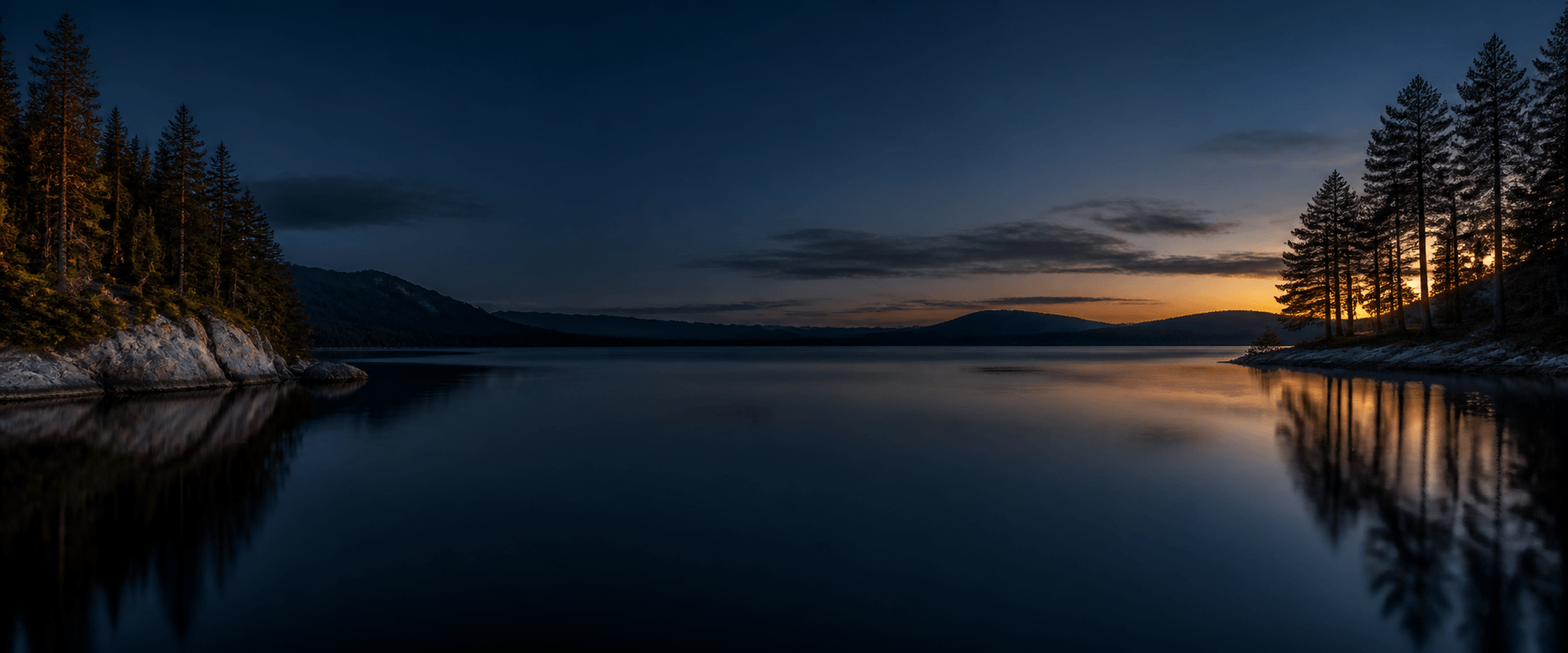Panorama of Northern New England lakes and mountains at blue hour